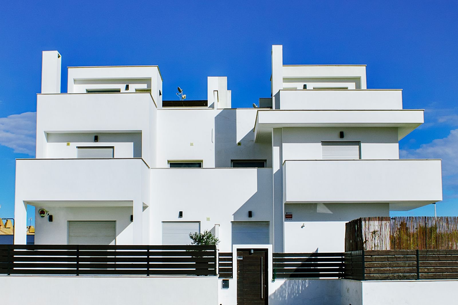 Modern white villas with fresh exterior paint